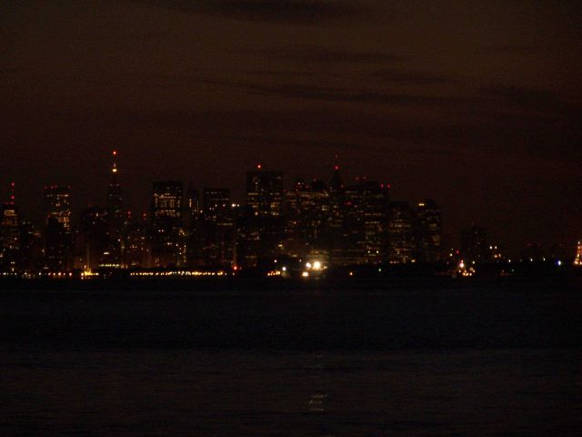 Night lights of New York City as seen from the Hudson River. Picture