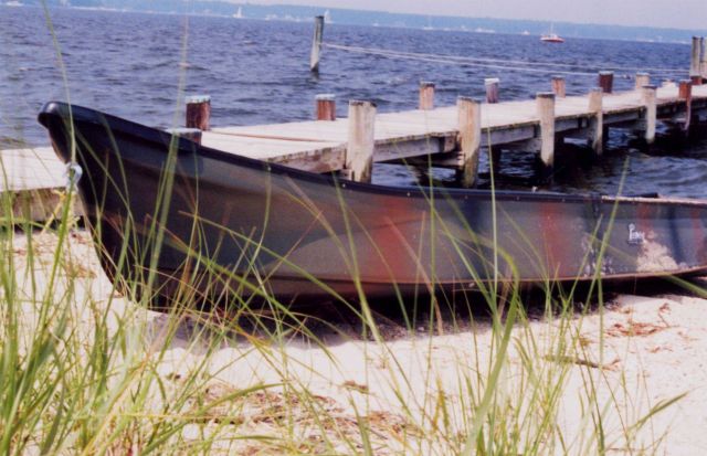 A camouflage-painted hunting skiff along the Patuxent River. Picture