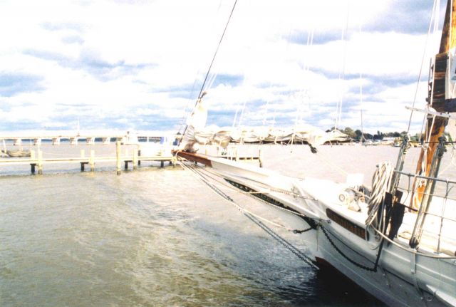 Clouds over bow of Maryland skipjack ELSWORTH along the Chester River. Picture