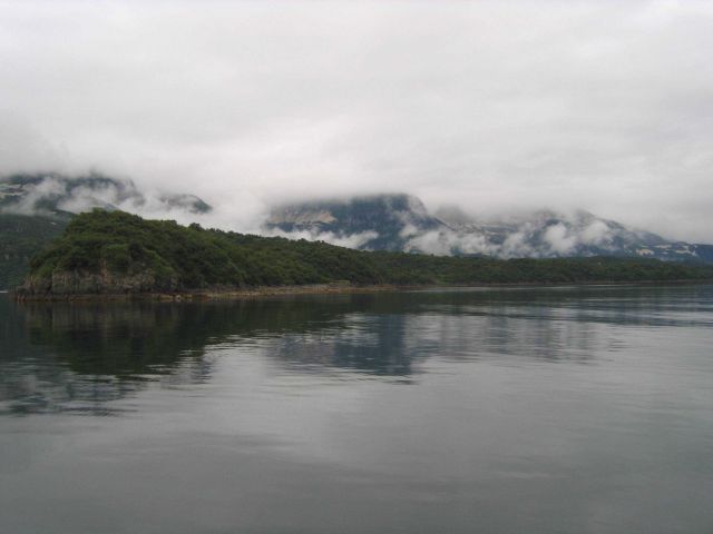 Fog, clouds, mountains, and a still inlet the Alaska Peninsula Picture