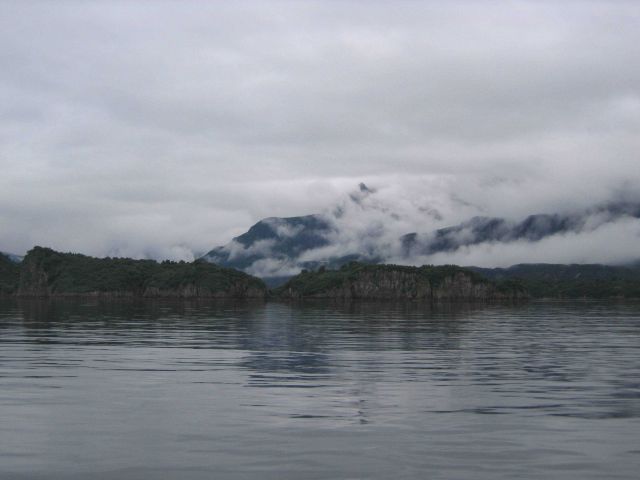 Mist-shrouded mountains over National Geographic Bay. Picture
