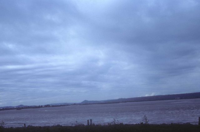 Shallow bay at low tide showing extensive mud flats Picture