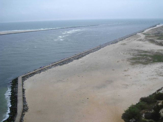 View to the east looking out the breakwaters at Barnegat Inlet from Barnegat Lighthouse. Picture