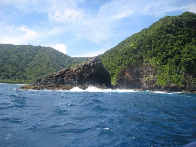 An offshore basaltic rock continually battered by the sea. Picture