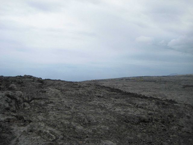 The barren landscape of a recent lava flow. Picture