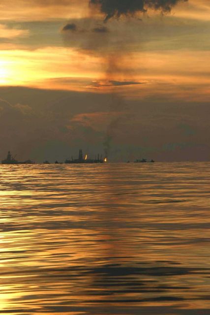 An oil recovery vessel flares gases during the summer 2010 oil spill Picture