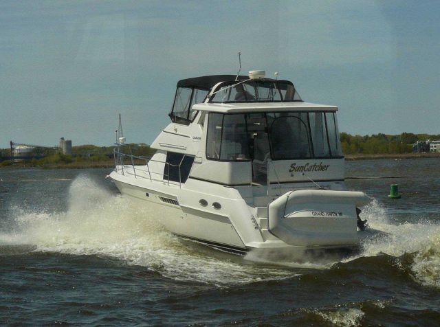 Pleasure boat leaving harbor Picture