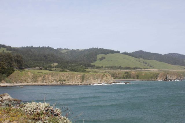 A view of the sea cliffs and coast ranges near Fort Ross, seen in the middle left. Picture