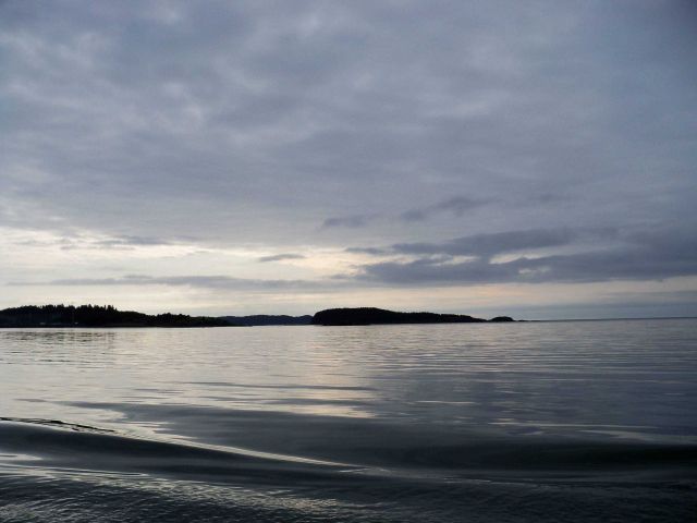 A rare day of glassy smooth waters on the Alaska shoreline Picture