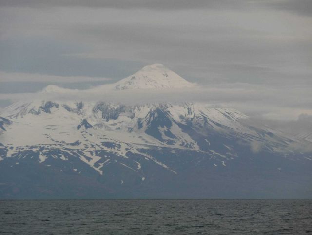 Mount Pavlof rising above layers of cloud Picture