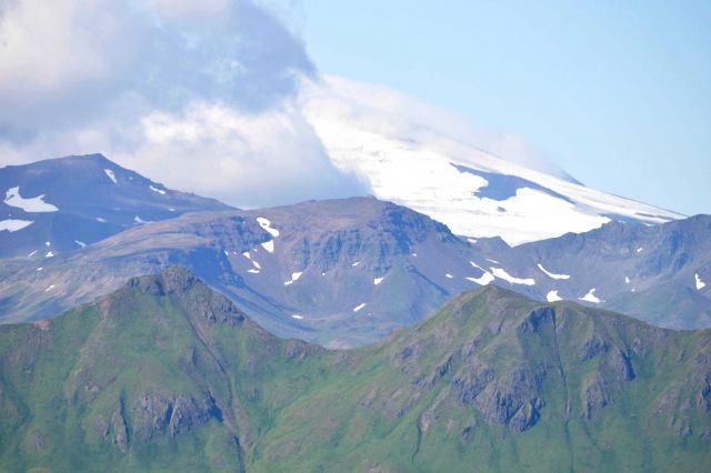 Looking towards Makushin Volcano over the green mountains of Unalaska Island. Picture