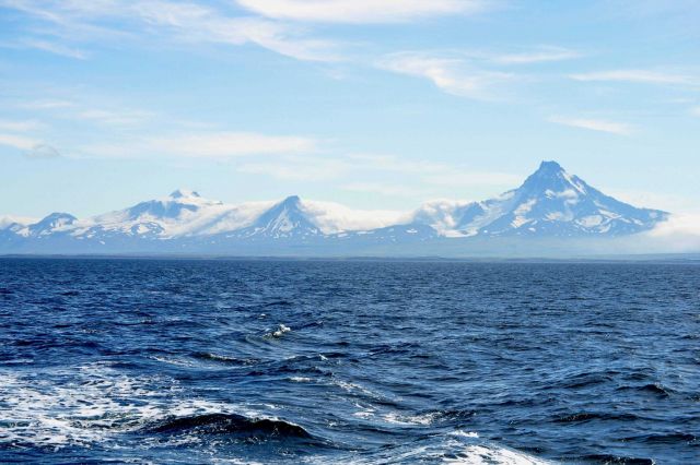 Roundtop is the high mountain on the left, the next is an unnamed peak designated Unimak 5270 by the Alaska Volcano Observatory, and Isanotski, locall Picture