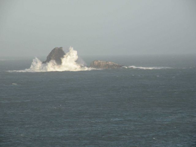 Waves crashing along offshore rocks near Point Piedras Blancas. Picture