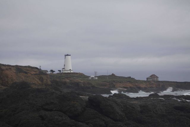 Looking to the south at the renovated Piedras Blancas Lighthouse from the rocky shoreline. Picture