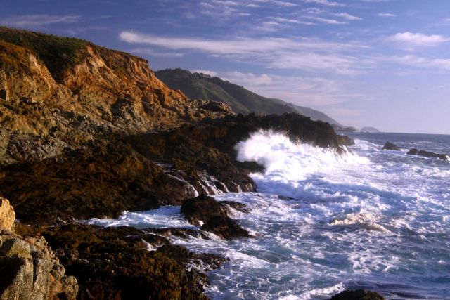 A wave breaking against the rocks of the Granite Canyon area along the Big Sur coastline Picture