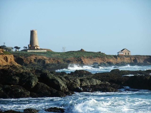 Looking south to the Point Piedras Blancas lighthouse over the shoreline at a high tide Picture