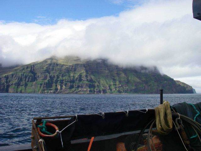 An Aleutian Island shrouded by fog. Picture