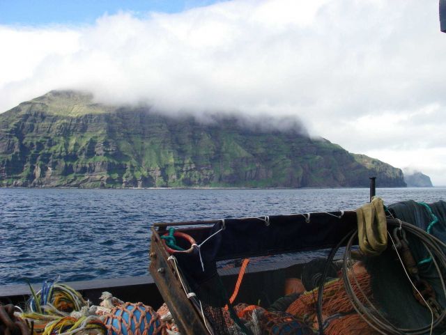 Layer upon layer of volcanic flows formed this cliff on Unimak Island. Picture