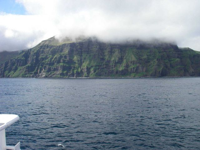 Layer upon layer of volcanic flows formed this cliff on Unimak Island. Picture