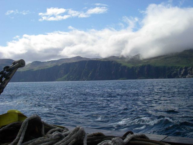Clouds pouring over an Aleutian island. Picture