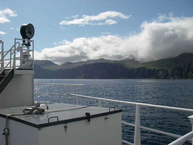Clouds pouring over an Aleutian island. Picture