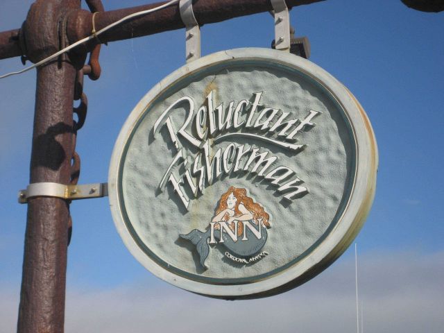 Signpost for the Reluctant Fisherman Inn. Picture