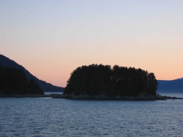 A small islet or perhaps just an extension of the mainland connected by a small isthmus. Picture