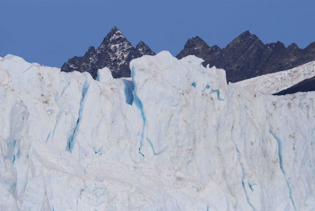 Mountain peaks behind Aialik Glacier front Picture
