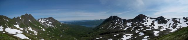 A mountain panorama looking down to the sea. Picture