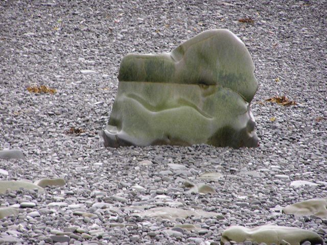 A smoothly eroded small boulder on a Shumagin Island pebble beach. Picture