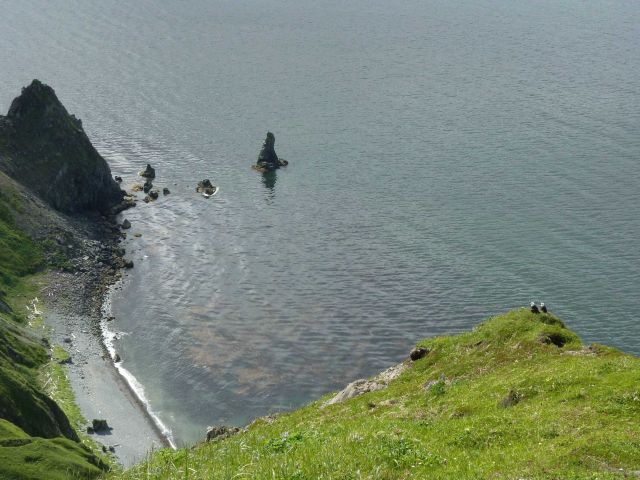 Looking down from a high cliff to a small beach in the Dutch Harbor area Picture