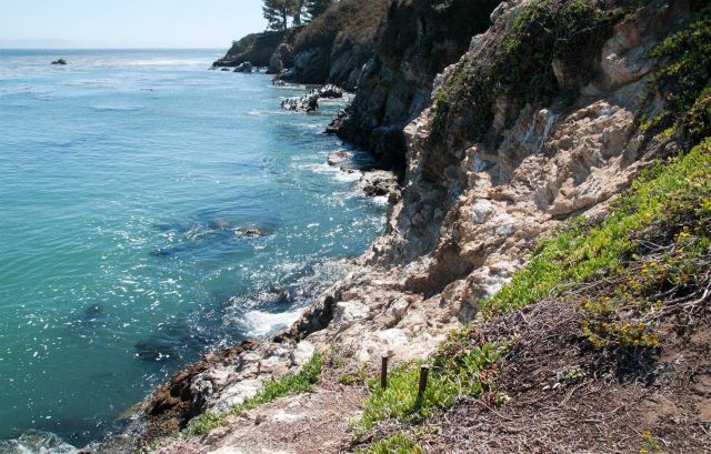 Blue Ocean water against the rocks. Picture