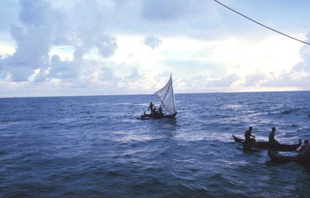 Native Micronesian fishermen greeting the TOWNSEND CROMWELL Few Micronesians use traditional sailing outrigger canoes today. Picture