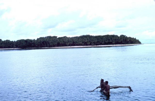 Natives visiting the TOWNSEND CROMWELL in outrigger canoe. Picture
