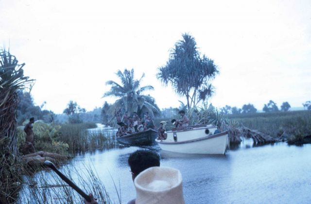 Native workers traversing the freshwater canal system. Picture