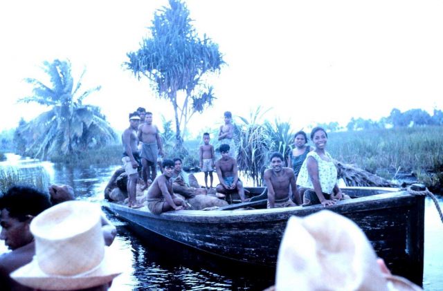 Micronesian workers traversing the freshwater canal system. Picture