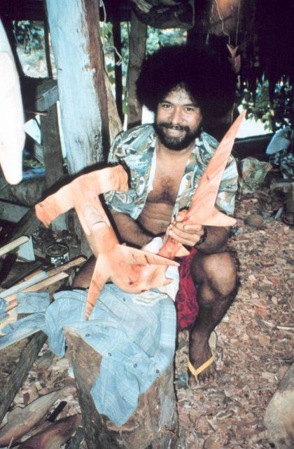 A master wood carver with a beautiful rendition of a hammerhead shark. Picture