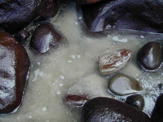 Rocks and sand at a cove on Isla Cocos. Picture