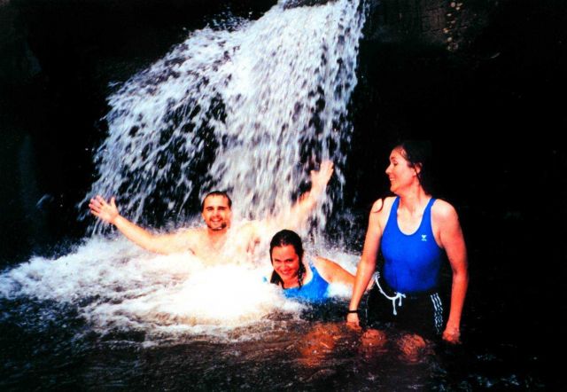 Deck hand Mike Theberge and two scientific observers cool off in a jungle stream on Isla Cocos. Picture