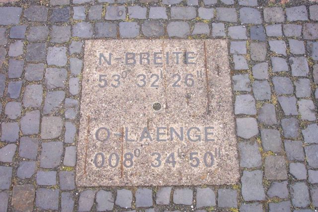 The latitude and longitude of Bremerhaven cast in stone. Picture