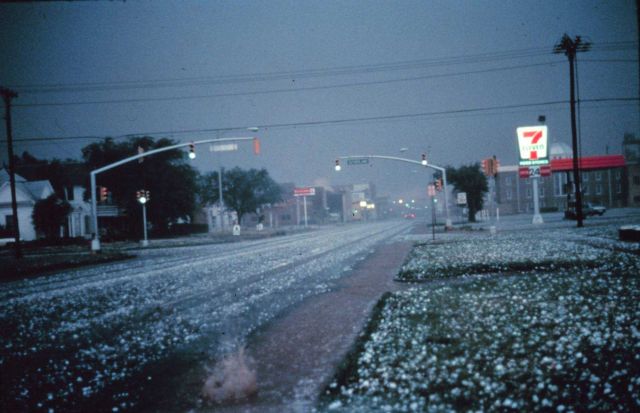 Large hail collects on streets and grass during severe thunderstorm Picture