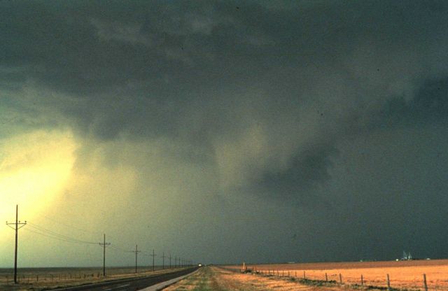Thunderstorm out flow from storm core shows up as sheets of wind driven rain spreading from right to left in 1982 photo. Picture