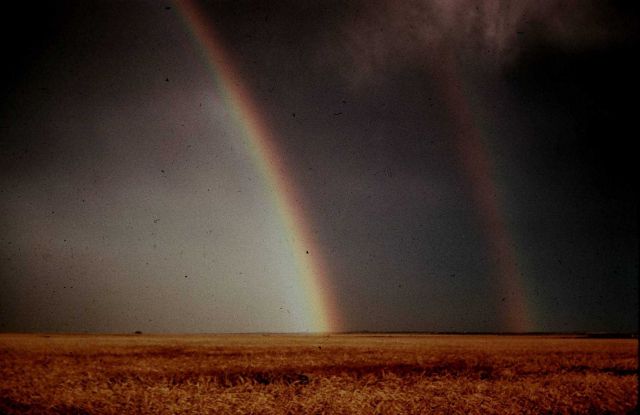 Rainbow with reflection - note reversal of spectrum. Picture