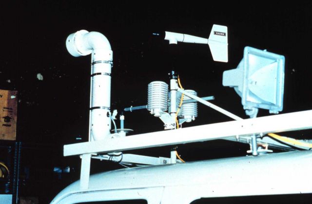NSSL vehicle with wind speed & direction sensors, humidity sensor, and temperature unit with fan. Picture