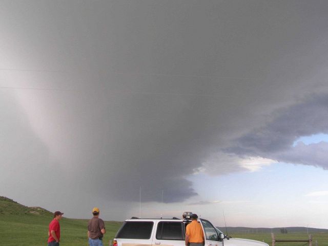VORTEX2 tornado investigators planning operations in vicinity of thunderstorm. Picture