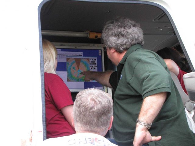 Terra Thompson (OU grad student), Mike Biggerstaff (OU), and Conrad Ziegler (NSSL) discuss the SR-2 radar image. Picture