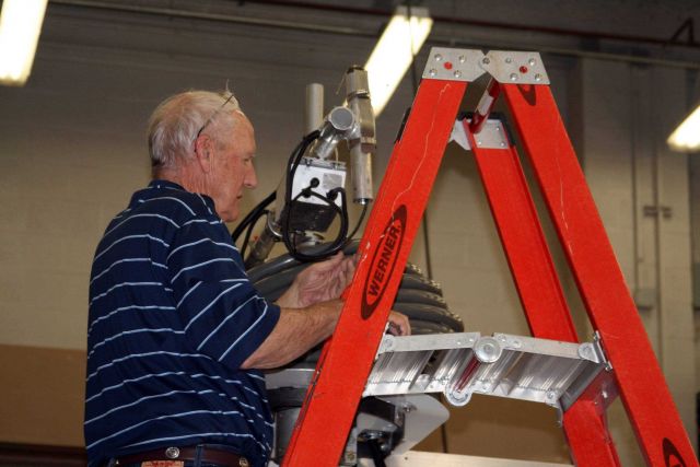 Dennis Nealson working on an anemometer in the NSSL truck bay Picture