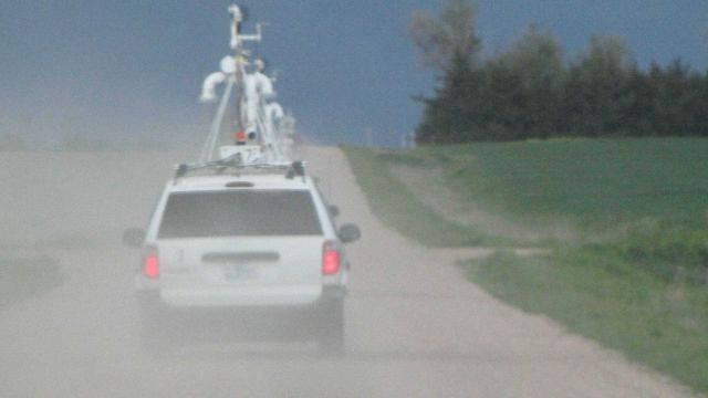 Mobile mesonet vehicles beginning their transects through storms. Picture
