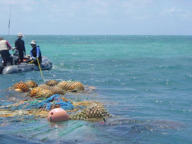 Towing a big derelict net back to the CASITAS Picture