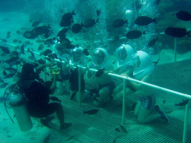 Tourists posing at a Guam reef attraction Picture